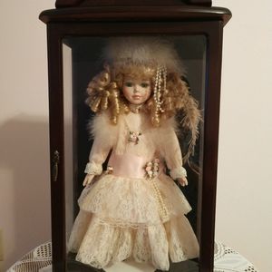 Porcelain doll with case